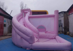 Pink jumping castle with a slide